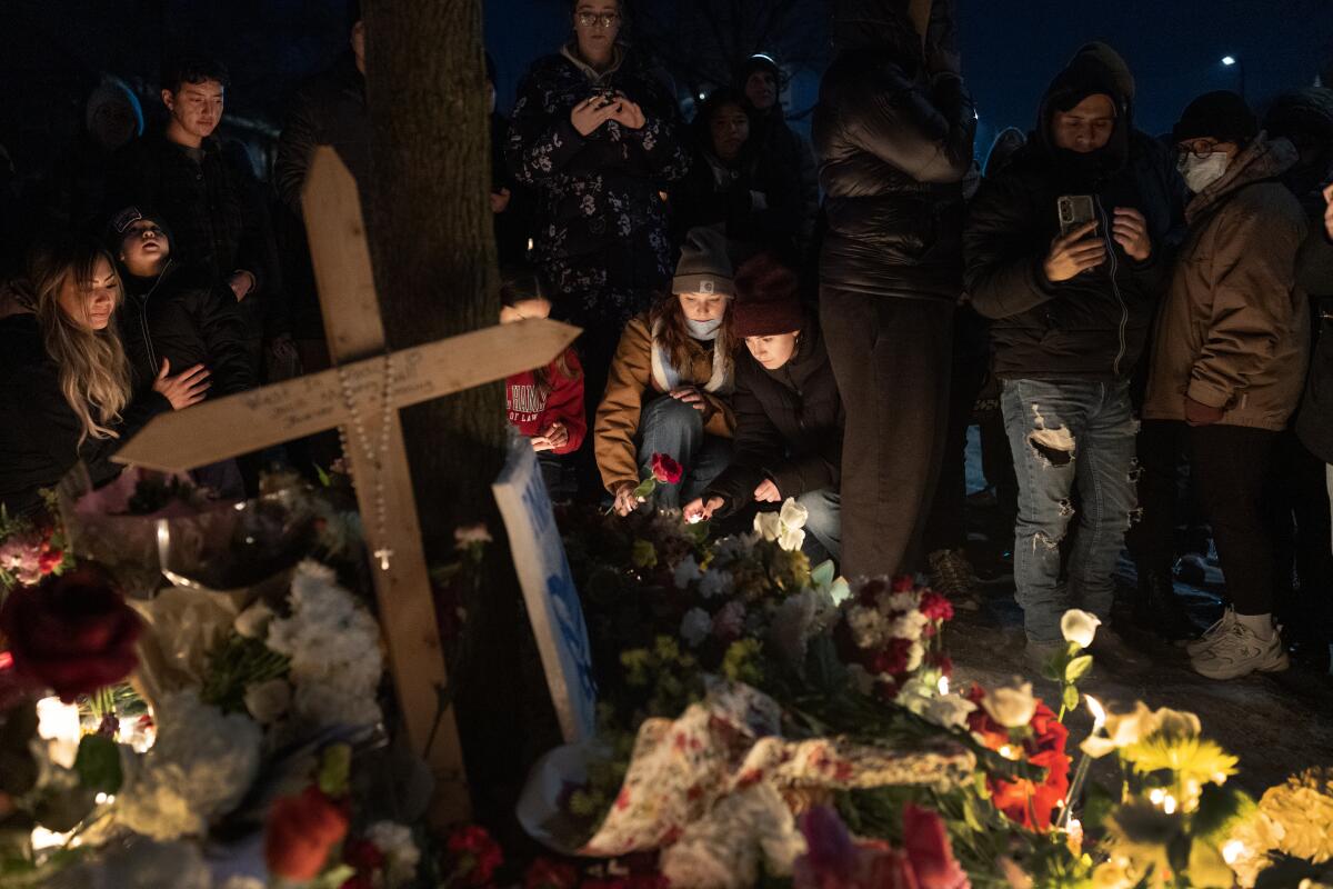 People visit a memorial for Renee Nicole Good on Jan. 7 in Minneapolis.