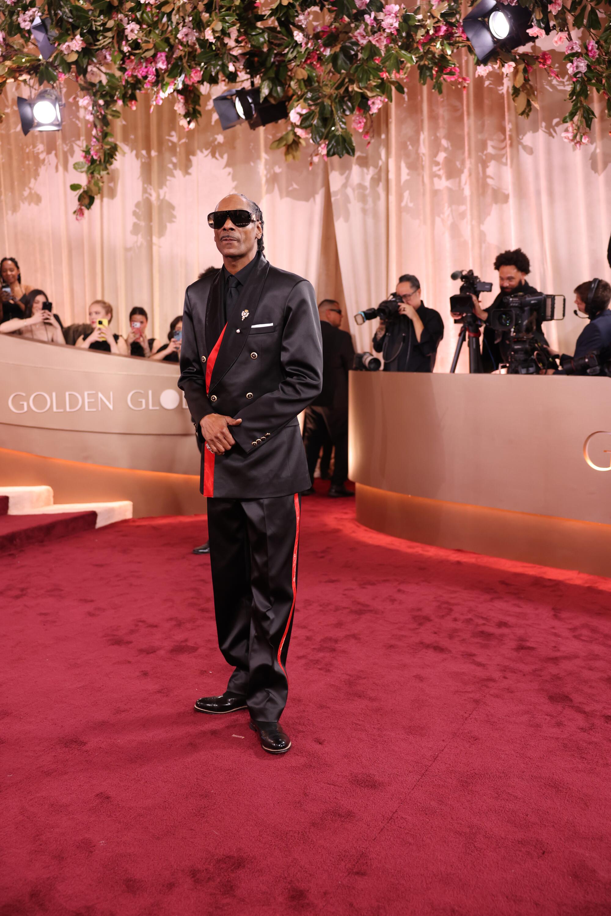 Snoop Dogg poses on the red carpet. 