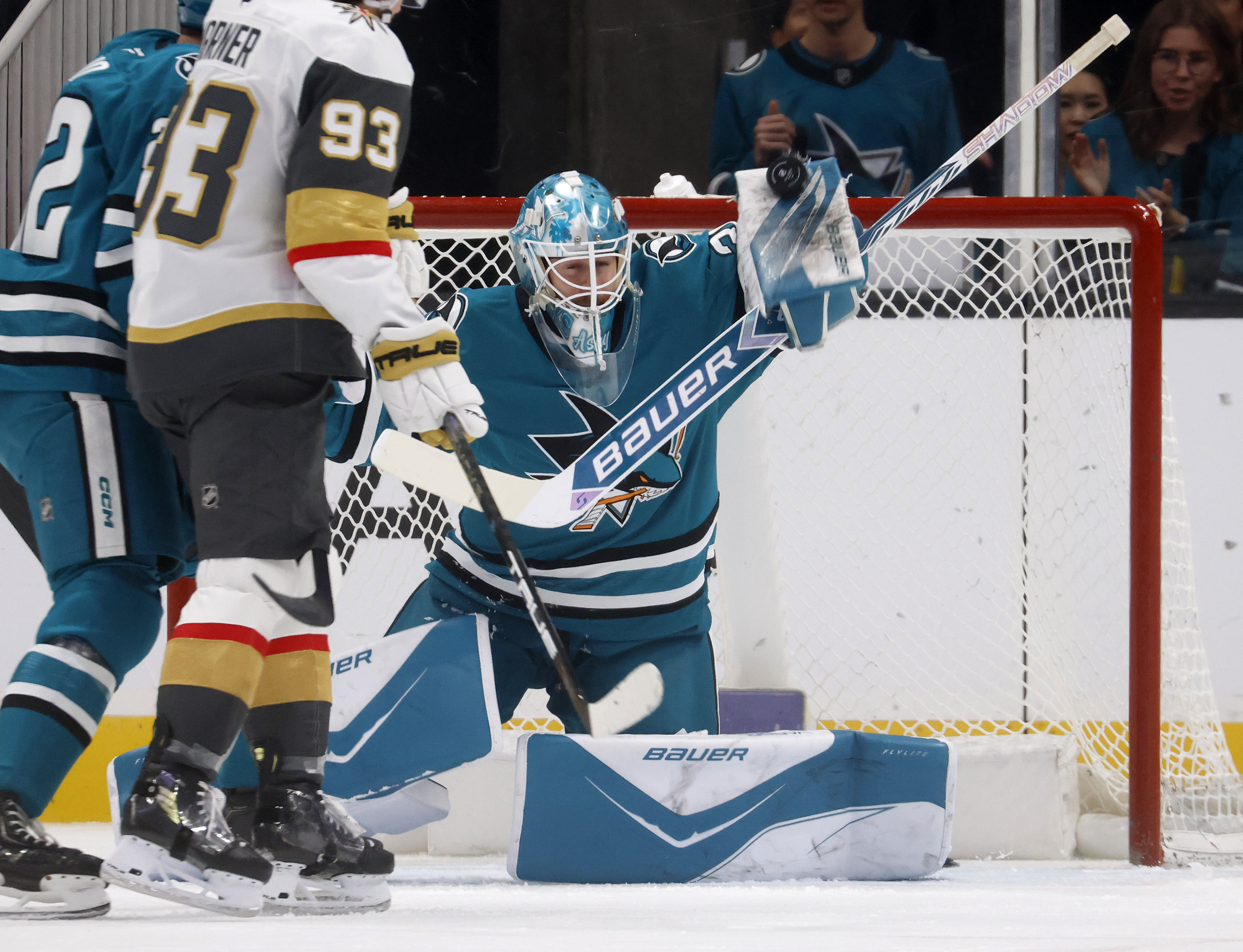 San Jose Sharks goaltender Yaroslav Askarov (30) stops a shot...