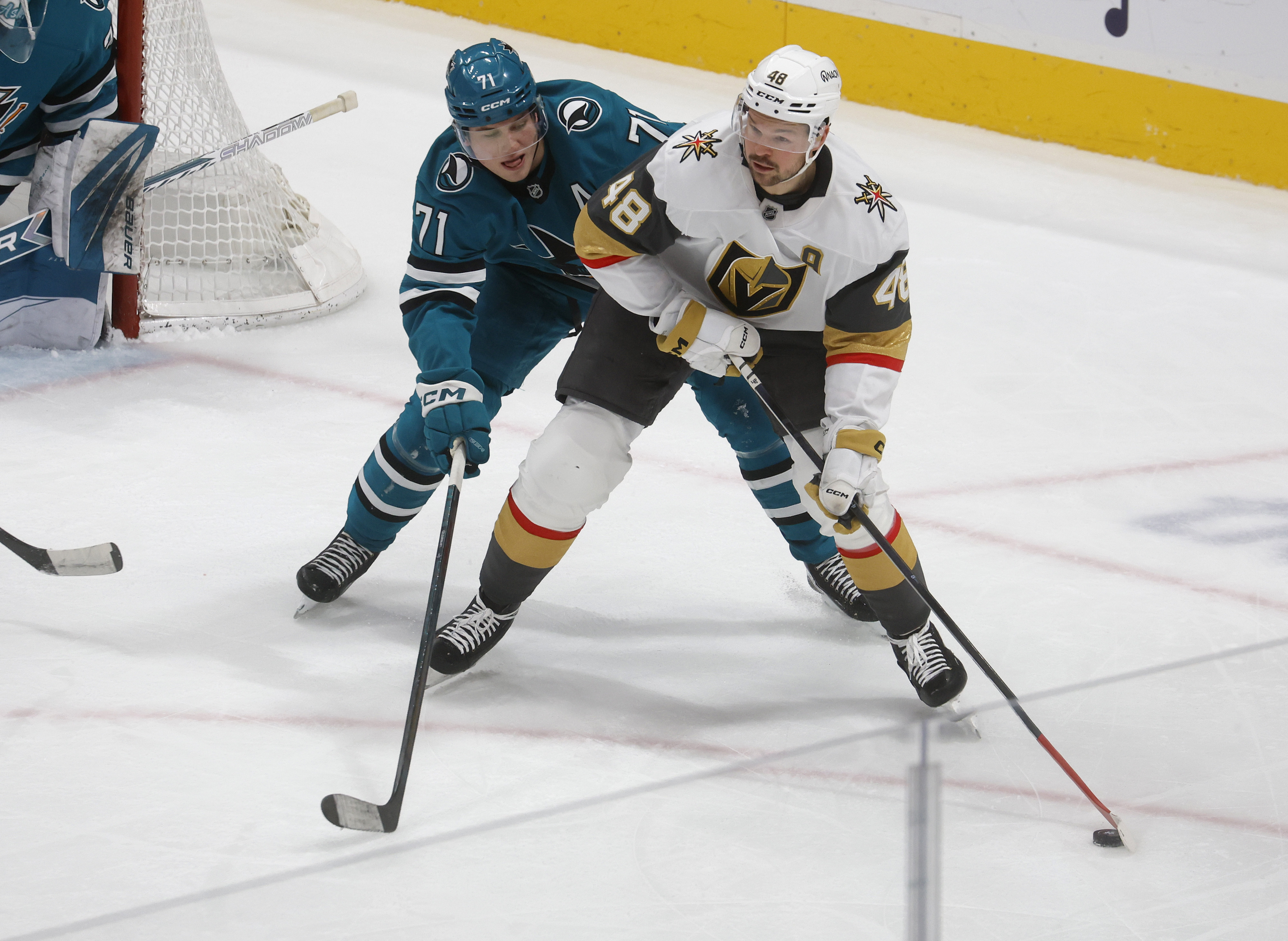 San Jose Sharks’ Macklin Celebrini (71) defends against Vegas Golden...