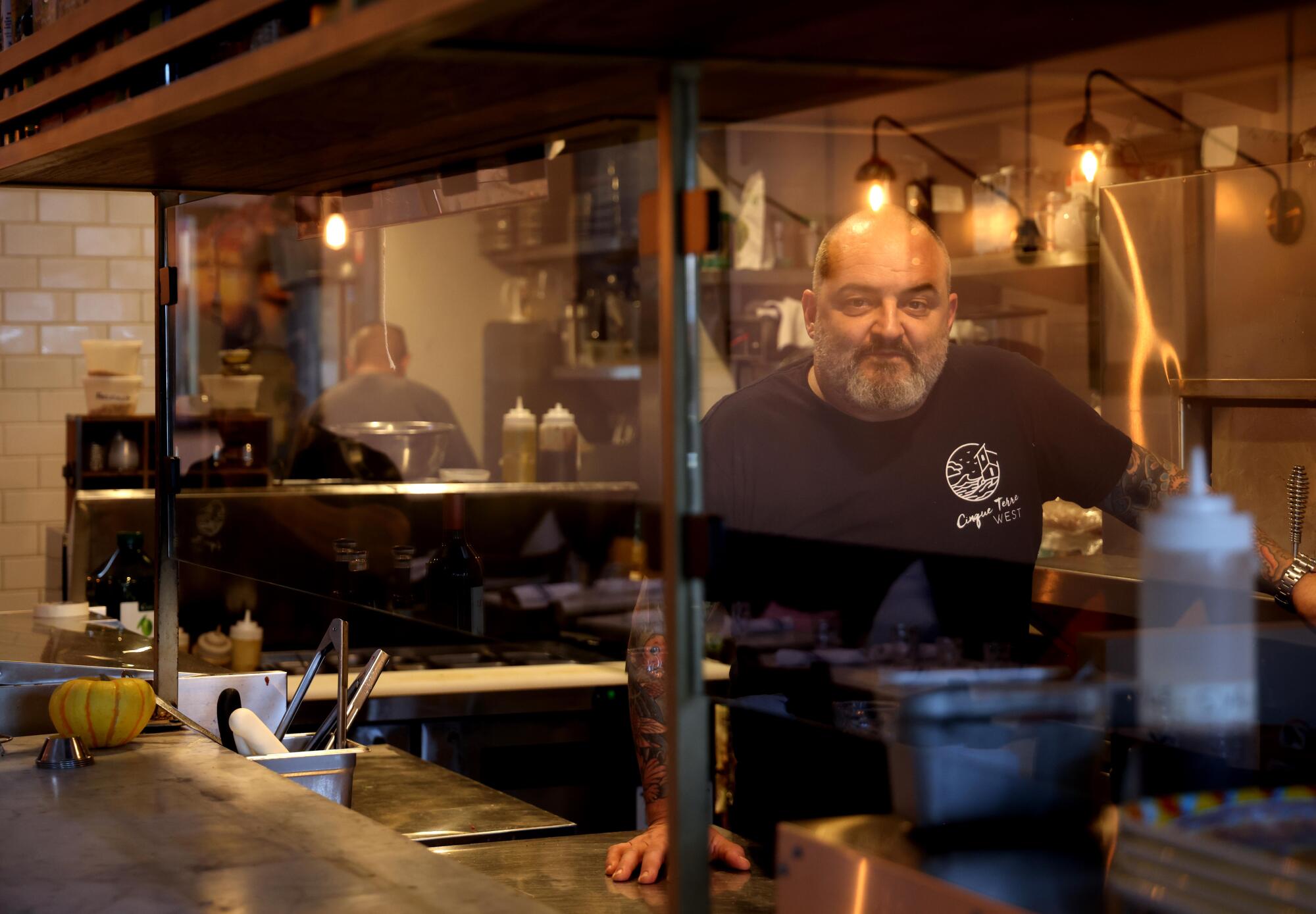 Cinque Terre West owner and chef Gianba Vinzoni stands in the kitchen of the restaurant