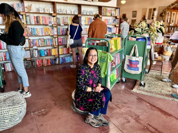 Jhoanna Belfer, owner of Bel Canto Books, prepares to move one of her store locations from The Hangout in Long Beach, where she was photographed on Dec. 9, 2023, to a storefront a few doors down on 4th Street. (Photo by Erik Pedersen/SCNG)