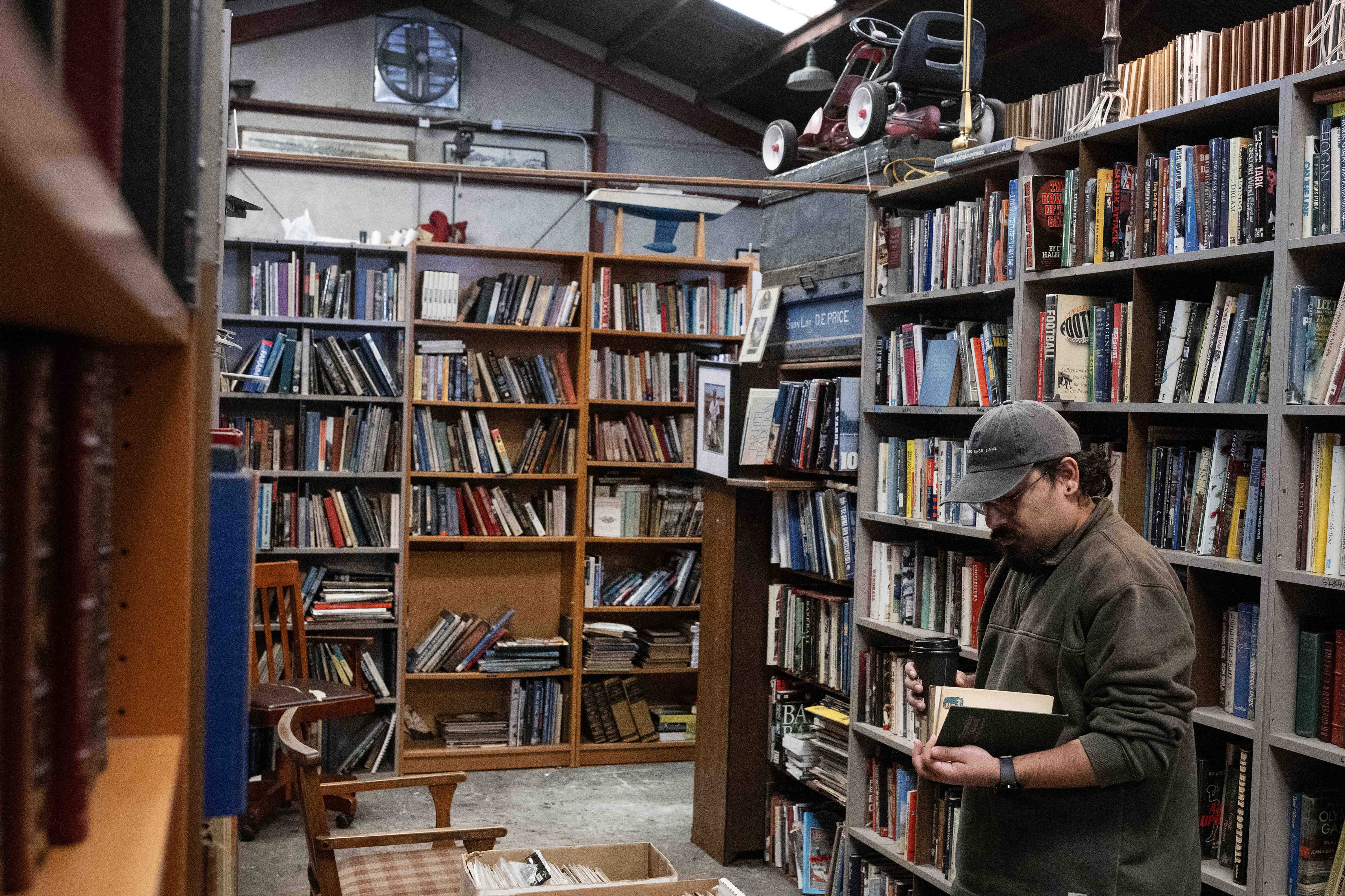 Marcos Gastelum browses books for sale at Planet Books in...