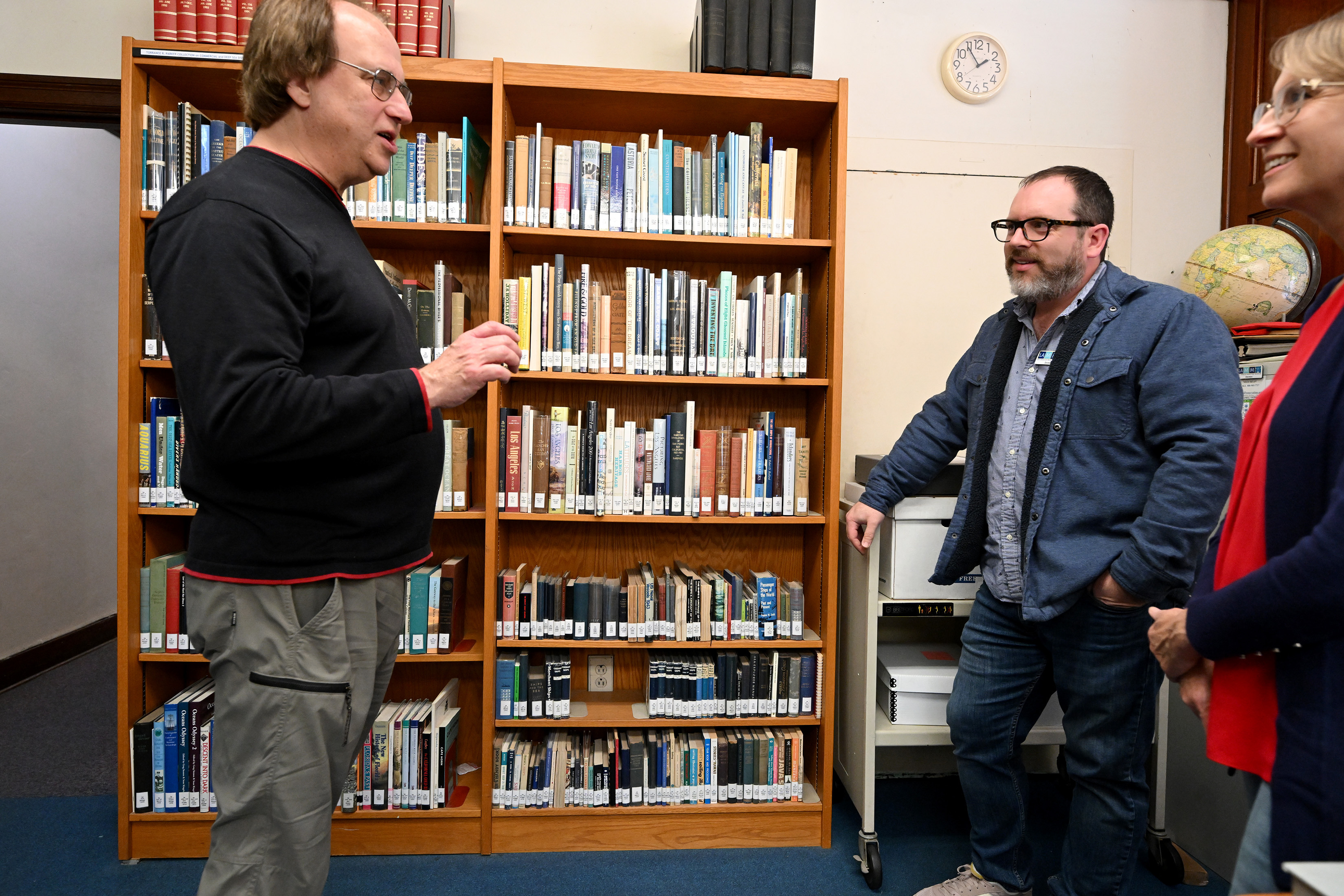 Derek Spinei, middle, an archivist with the Los Angeles Maritime...