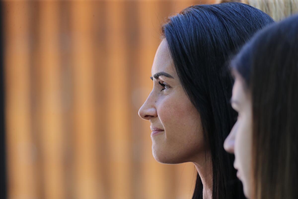Joanna Cloonan smiles during a 2021 event to dedicate a plaque to her slain son at Irvine Regional Park.