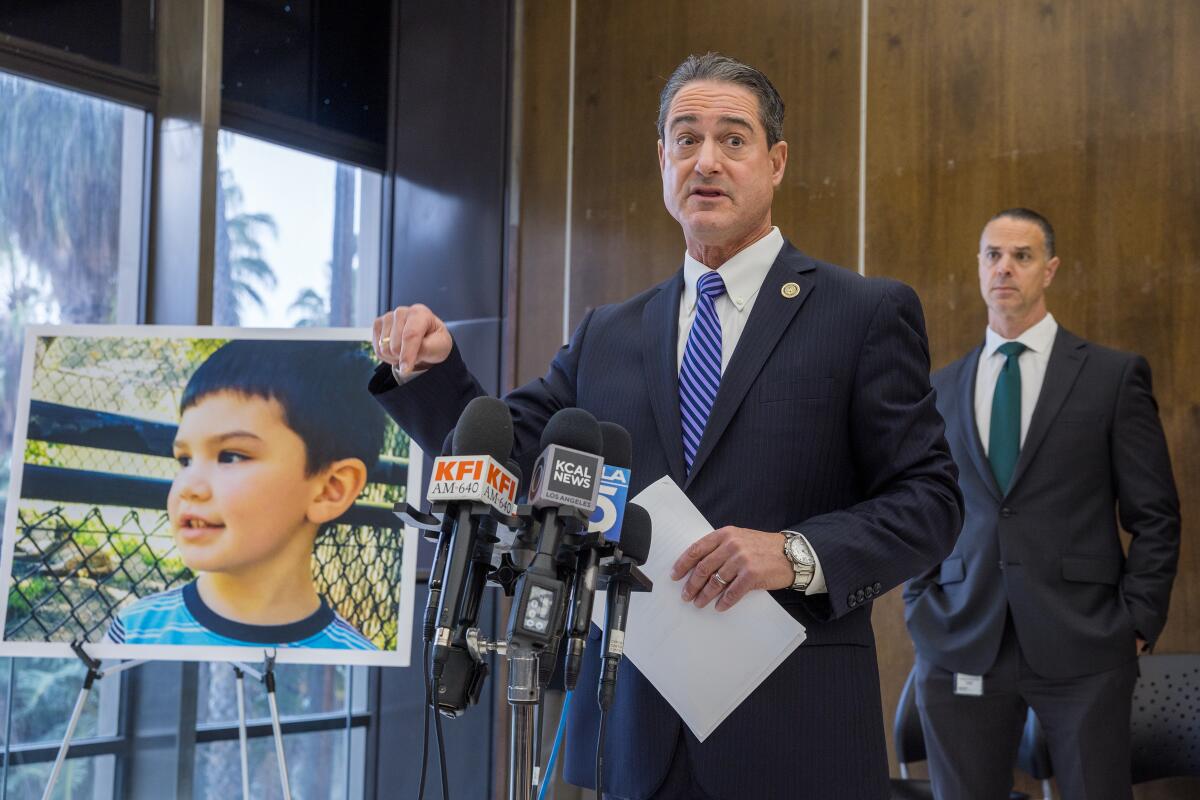 April 2024 photo of Orange County District Attorney Todd Spitzer, center, during a news conference.
