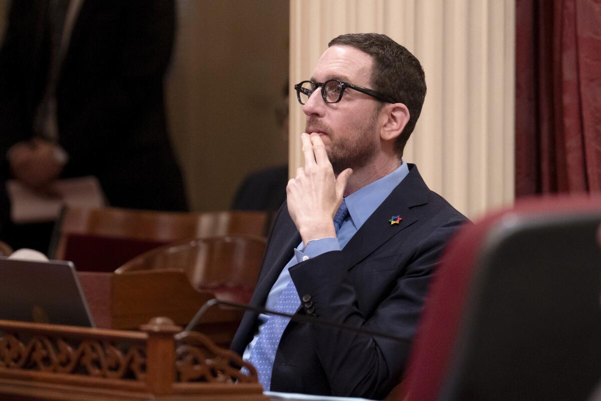 State Sen. Scott Wiener, seated 