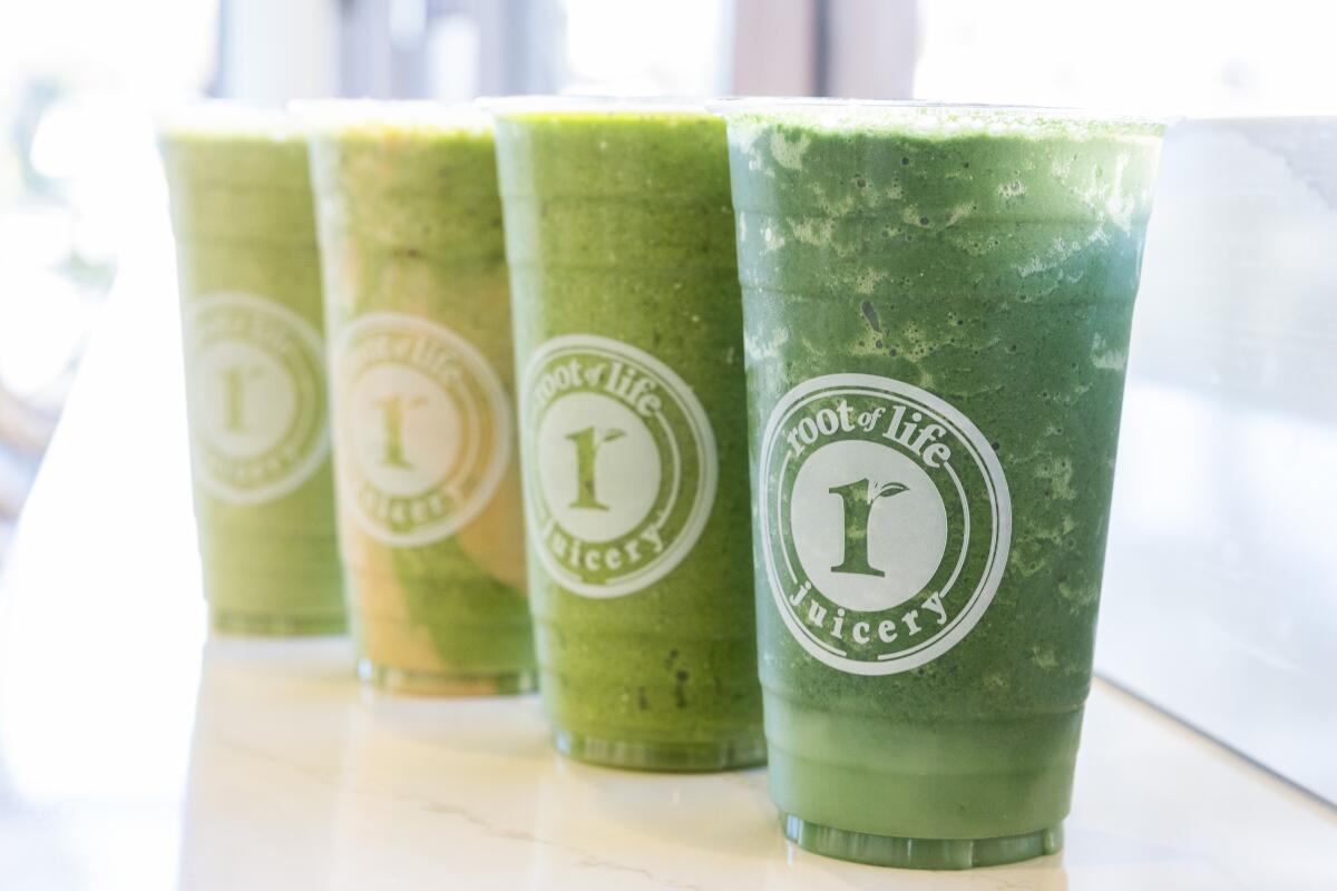 Left to right: Slim Shady, Green N Nutty, Glow and Vida at Roots of Life in Huntington Park.