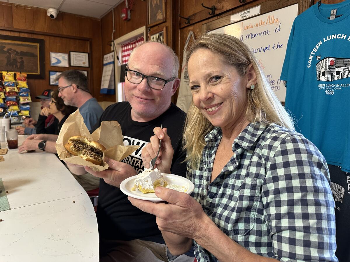 Beth M. Howard and cinematographer Kent Abbott lunch during a screening of "PIEOWA" in Ottumwa, Iowa.