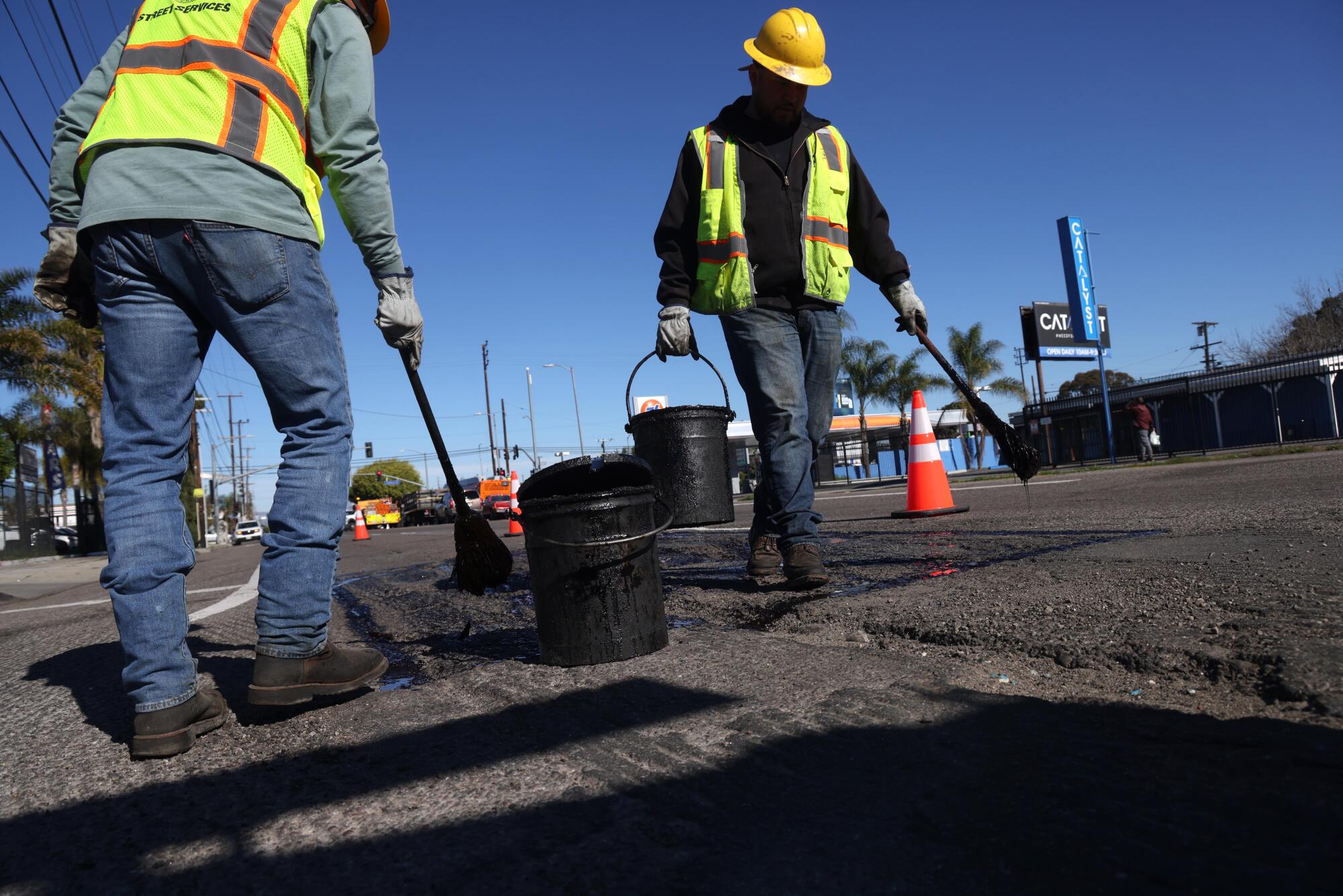 Workers repairing potholes