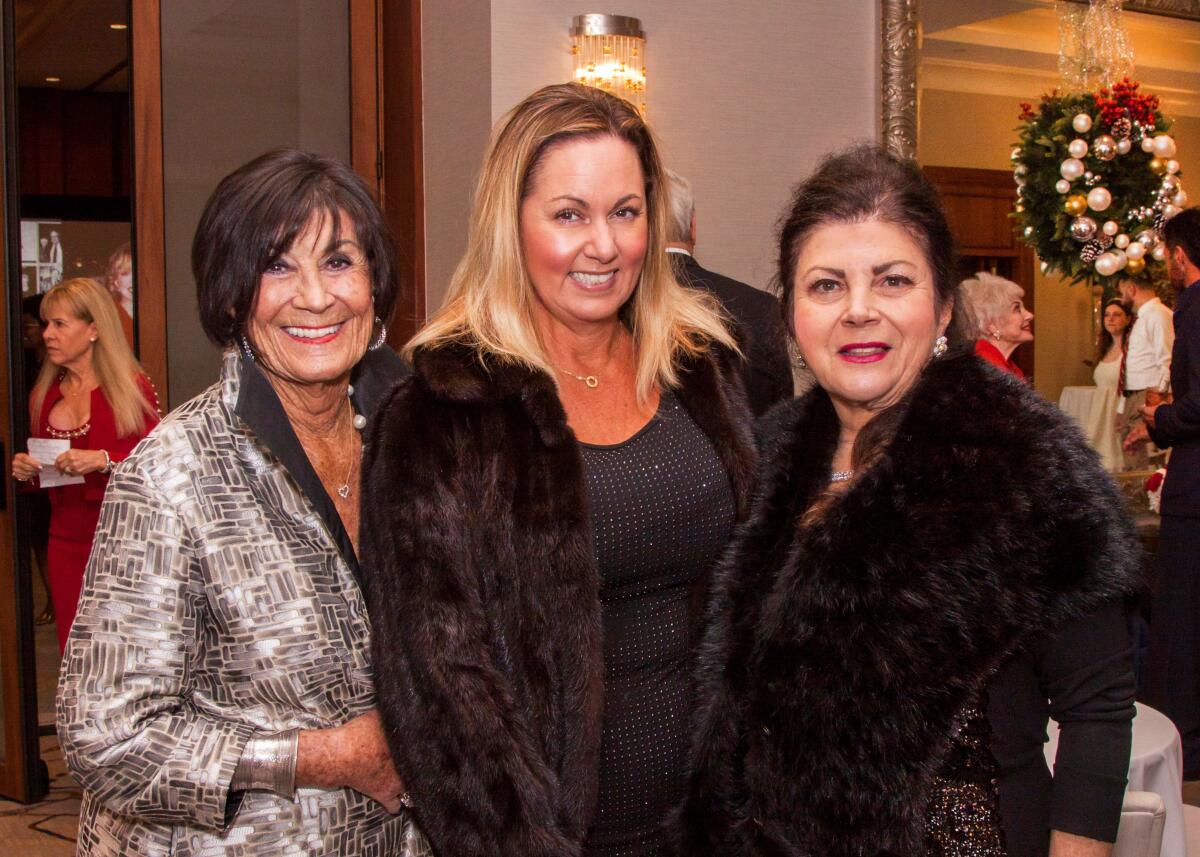 Community leaders Janet Curci, Michelle Goeden and Lisa Hallaian pose at 39th annual Christmas at the Ritz event.