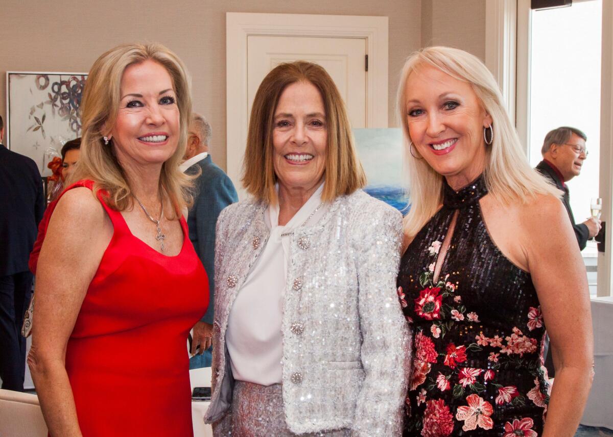 In the crowd at the Christmas at the Ritz at Balboa Bay Resort were Tricia Bailey, from left, Sue Hook and Kristi Jacobs.