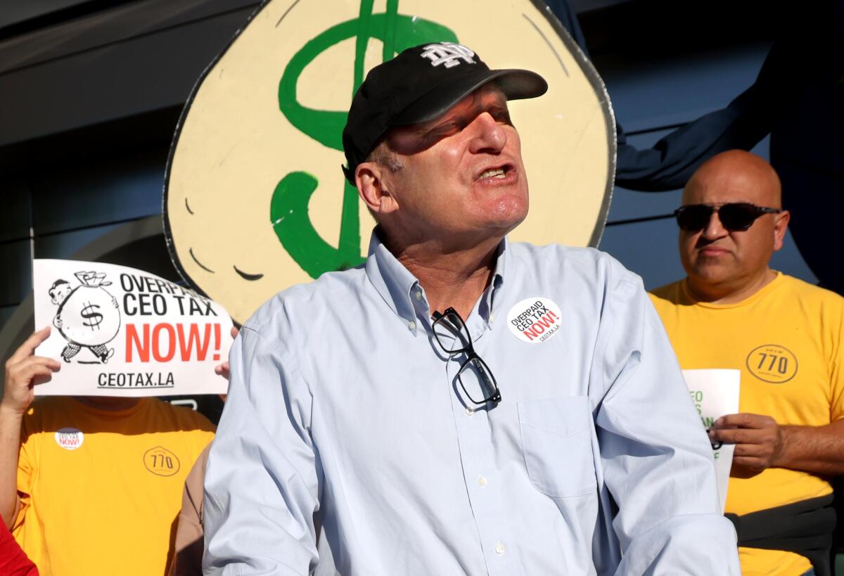 Kurt Petersen, co-president of UNITE HERE Local 11, speaks at a rally.