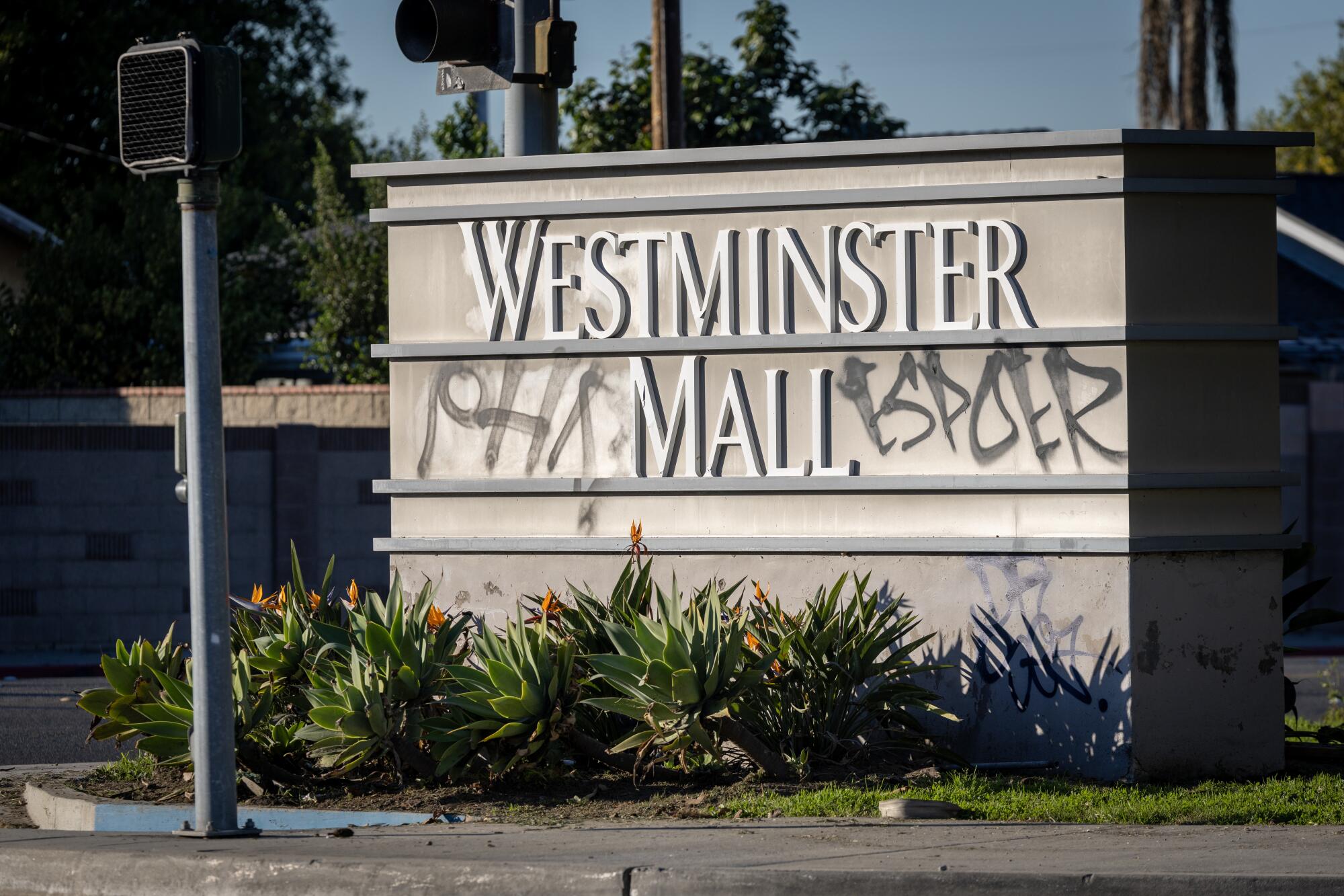The Westminster Mall entrance sign with graffiti.