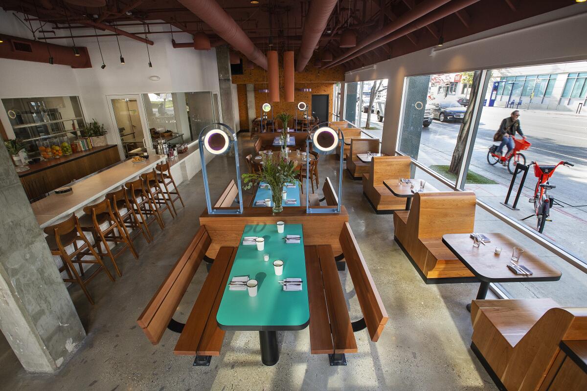 The interior of Socalo featured dichroic lighting fixtures, custom cherry wood tables and booths.