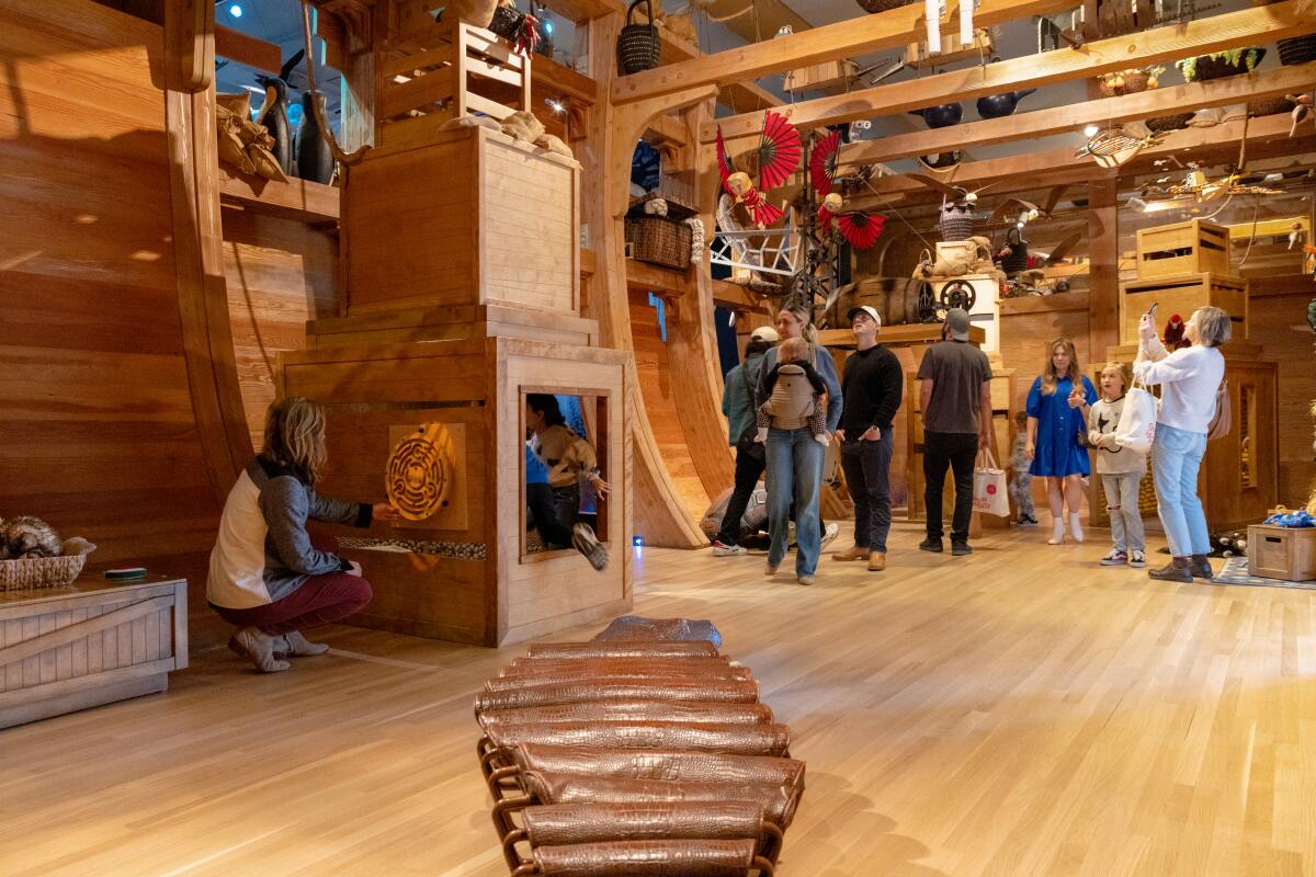 Kids inside a museum exhibit.