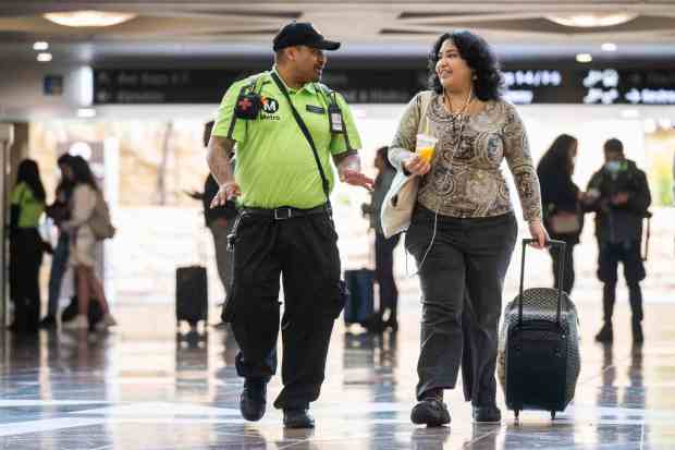 LA Metro Transit Ambassador Steve Gonzalez helps a woman find her train in Union Station on Friday, June 7, 2024 in Los Angeles. (Photo by Sarah Reingewirtz, Los Angeles Daily News/SCNG)