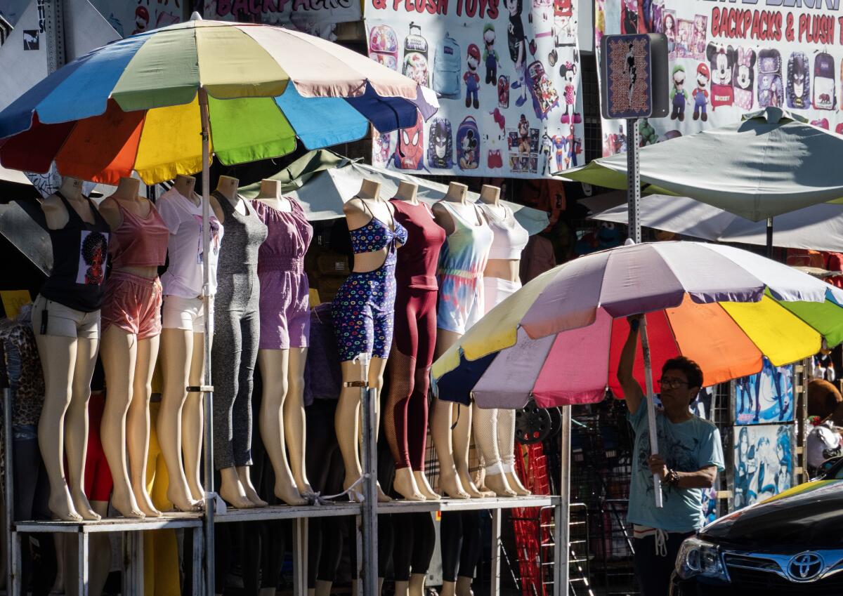 Displays are put up as stores open in the Fashion District in Los Angeles.
