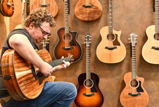 Music Teacher George tries out a Taylor guitar during The NAMM Show at the Anaheim Convention Center in Anaheim, CA, on Thursday, Jan. 23, 2025. (Photo by Jeff Gritchen, Orange County Register/SCNG)