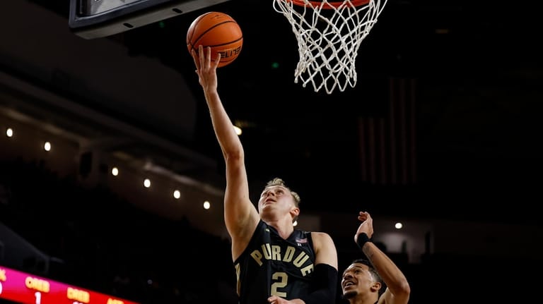 Purdue guard Fletcher Loyer (2) drives to the basket with...
