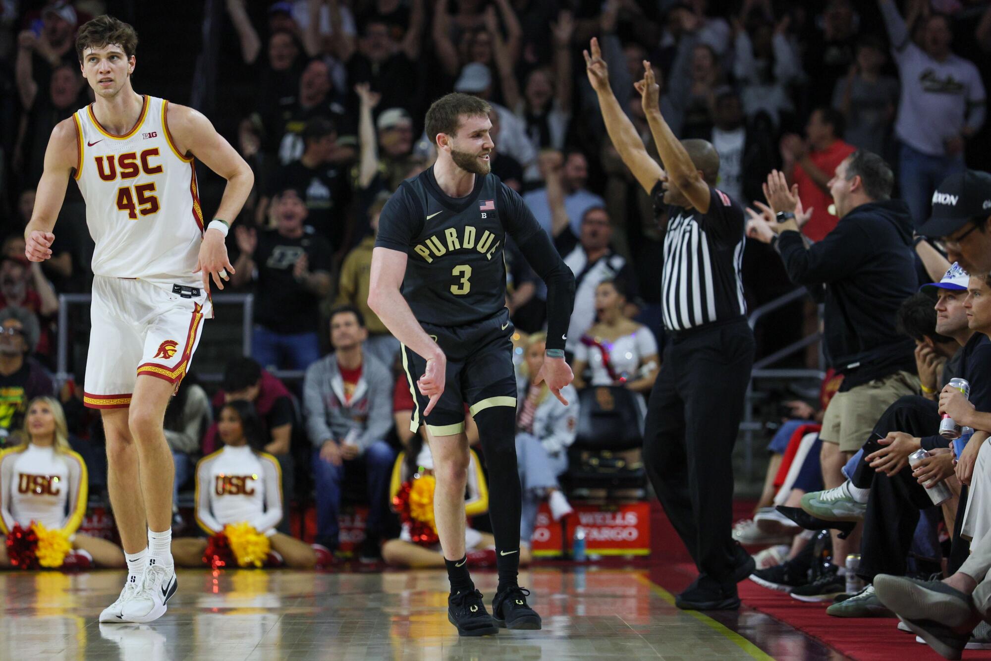 Purdue guard Braden Smith, right, celebrates a three-pointer near USC center Gabe Dynes during the first half Saturday.