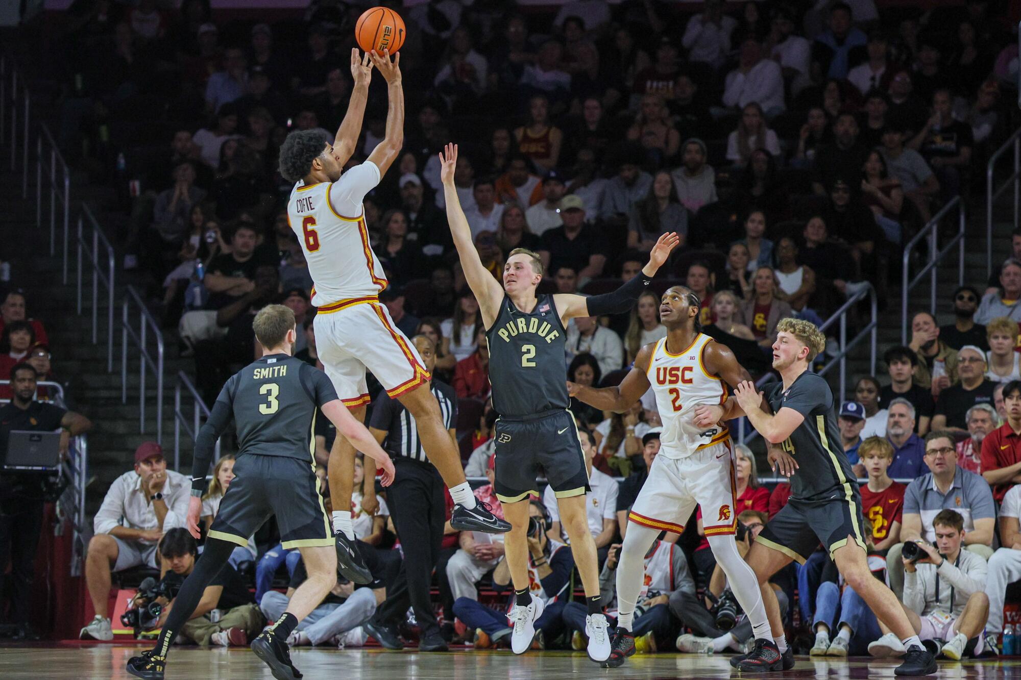 USC forward Jacob Cofie attempts a three-pointer against Purdue on Saturday at Galen Center.