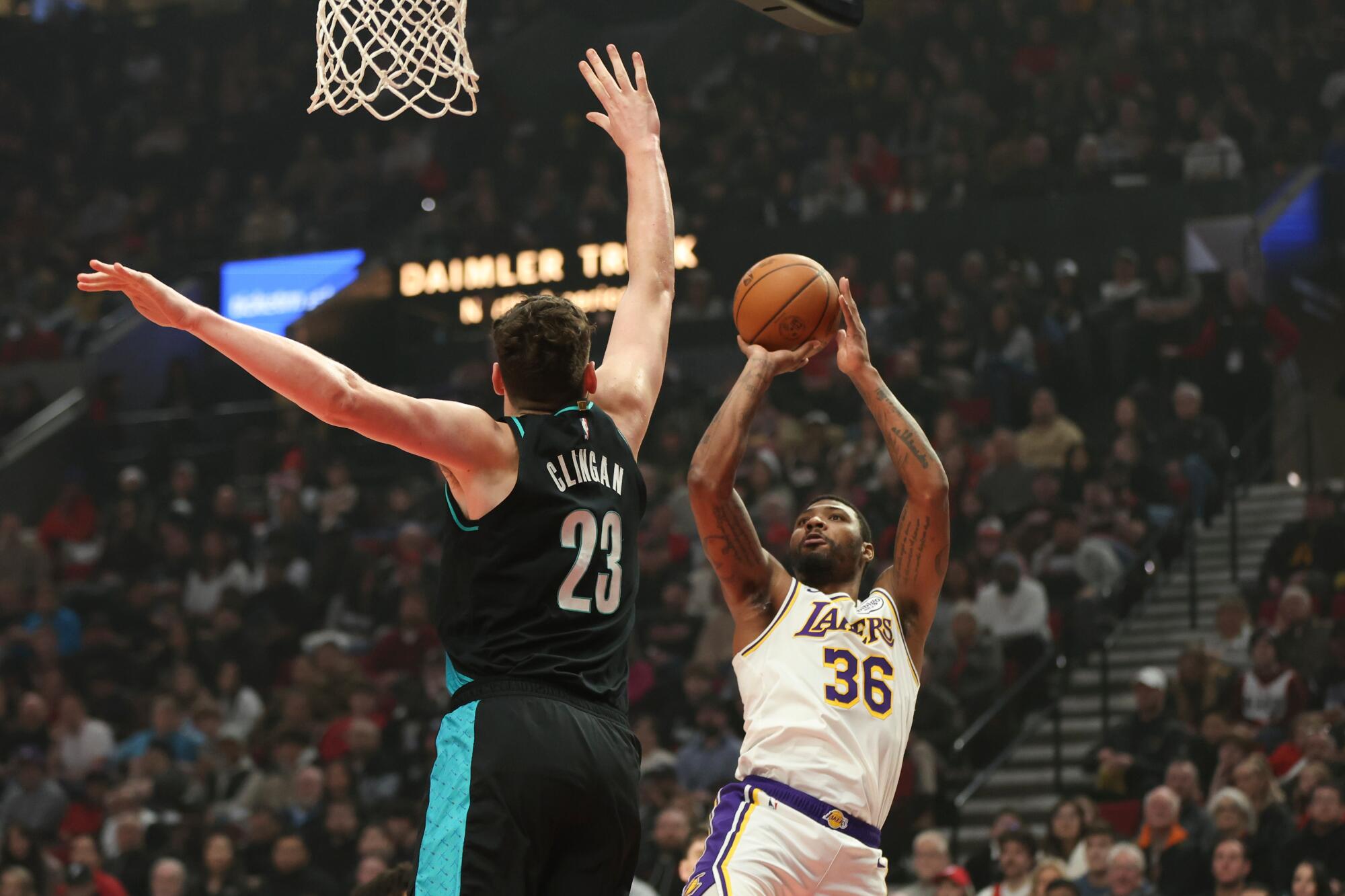 Lakers guard Marcus Smart shoots over Portland center Donovan Clingan in the first half Saturday.