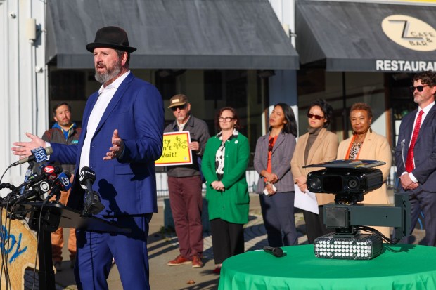 An automated speed safety camera is displayed on a table as Oakland Transportation Director Josh Rowan speaks during a news conference at the intersection of 27th Street and Broadway in Oakland, Calif., on Friday, Jan. 16, 2026. 18 cameras have been installed at different locations throughout the city and began issuing warnings on Jan. 14, 2026. They are scheduled to begin issuing speeding tickets in mid-March 2026, according to city officials. (Ray Chavez/Bay Area News Group)