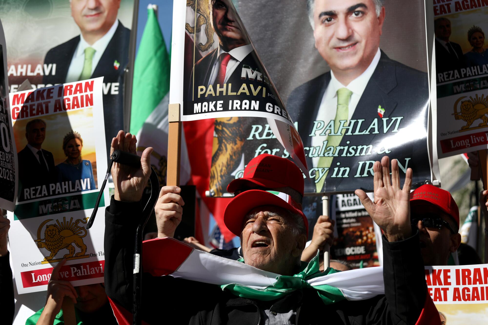 Satar Nosadeghi along with Iranians gather for a Make Iran Great Again march / rally.
