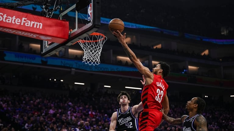 Portland Trail Blazers forward Toumani Camara (33) goes for a...