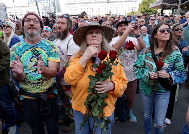 Grateful Dead fan Alexis Lacivita, of San Francisco, center, and others attend the Bob Weir memorial at Civic Center Plaza in San Francisco, Calif., on Saturday, Jan. 17, 2026. Thousands of people gathered to say goodbye to the band's co-founder and guitarist, who passed away on Jan. 10. (Jane Tyska/Bay Area News Group)