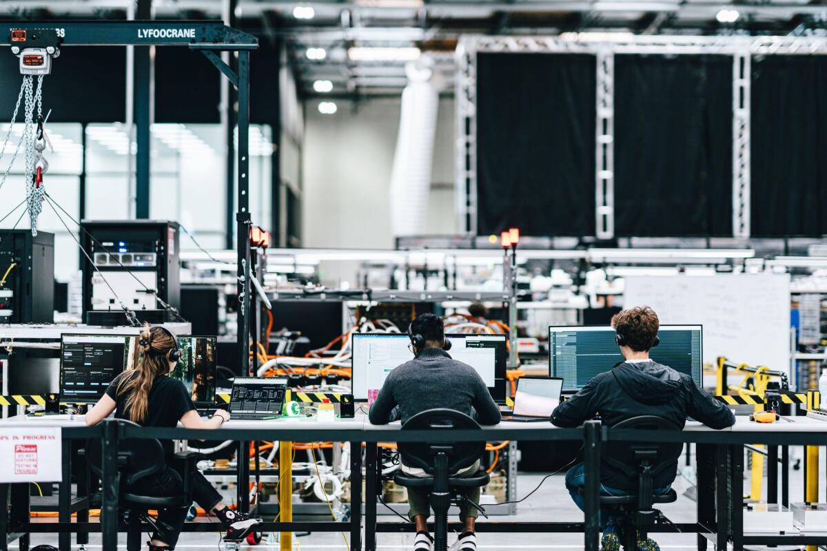 Workers at K2 Space in Torrance, where the startup is building high-capacity satellites for Medium Earth Orbit. (K2 Space)