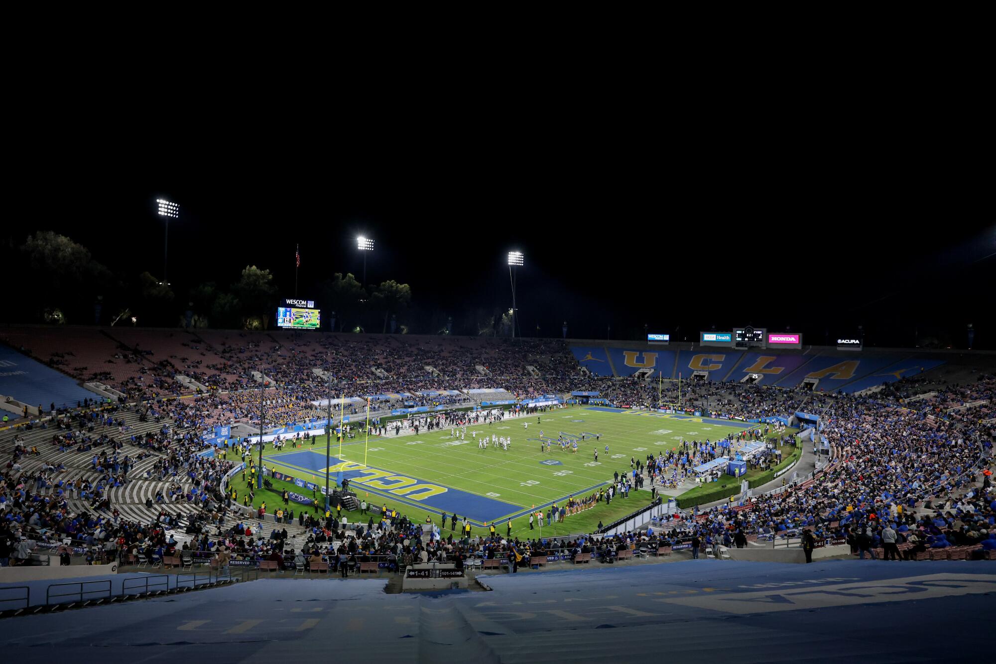 Fans watch UCLA play Washington at the Rose Bowl on on Nov. 22.