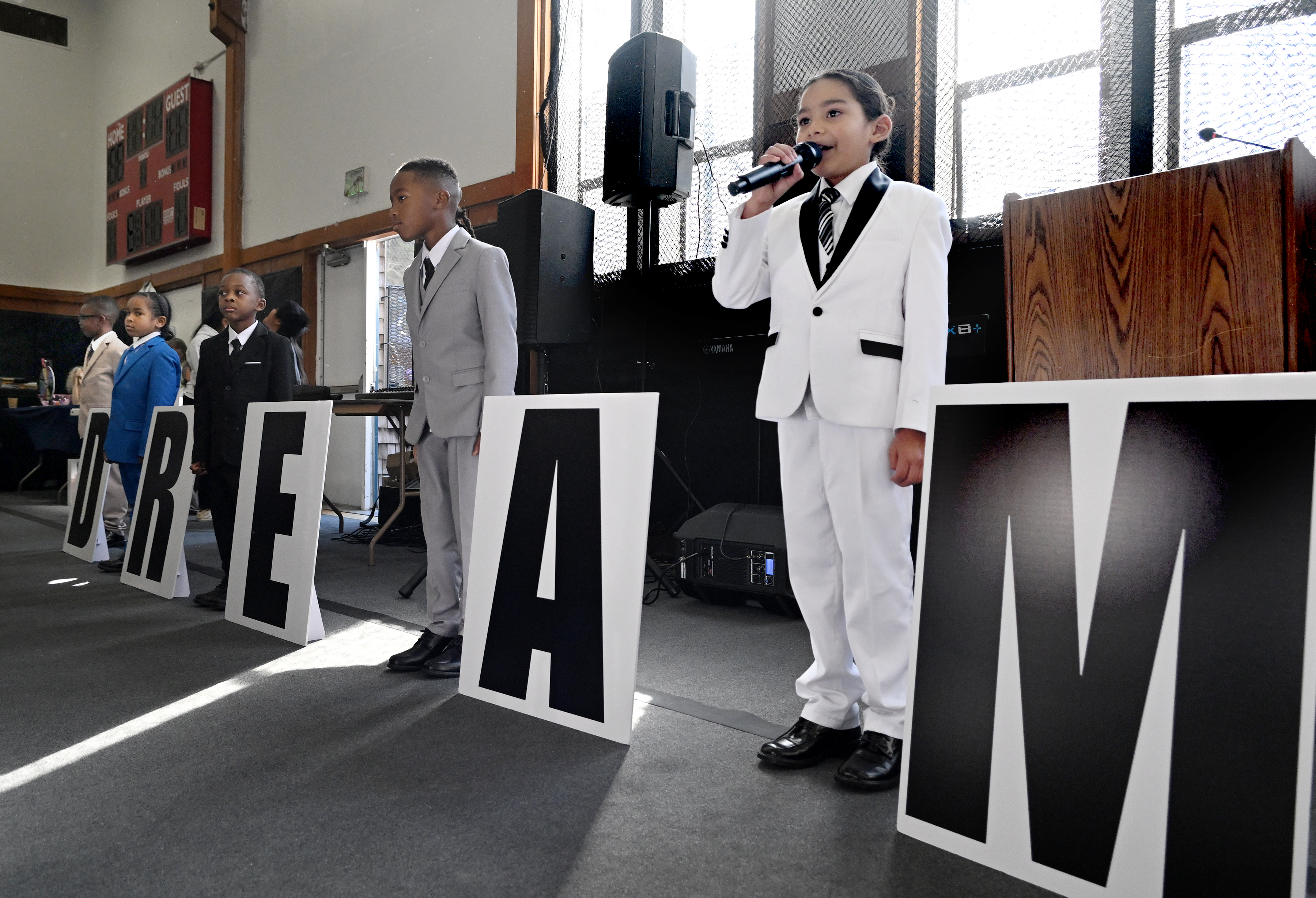 Kids from Performing Stars of Marin give their presentation during...