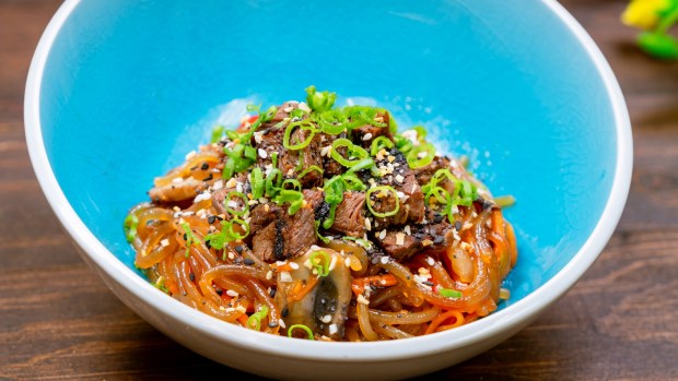 Japchae Noodles available at Longevity Noodle Co. marketplace booth during the 2026 Lunar New Year food festival at Disney California Adventure. (Courtesy of Disneyland)