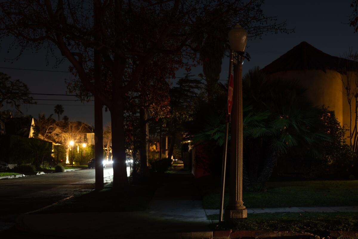 Solar-powered light attached to a non functional street lamp