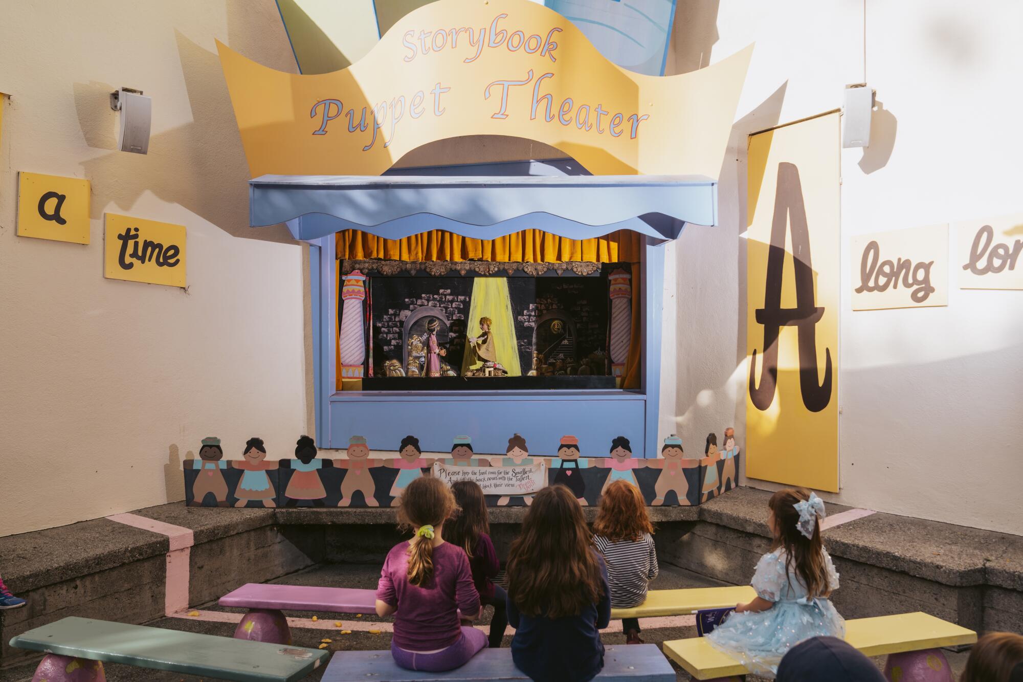 Children watch "King Midas and the Golden Touch" at the Storybook Puppet Theater at Children's Fairyland in Oakland. 