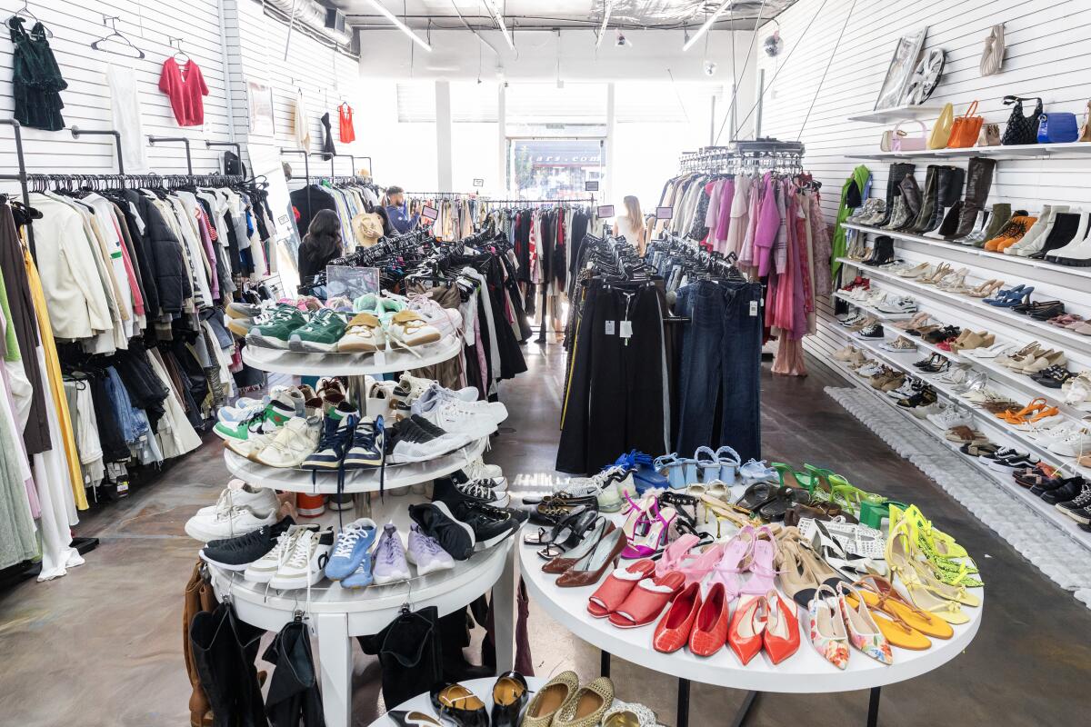 clothes and shoes displayed inside a store