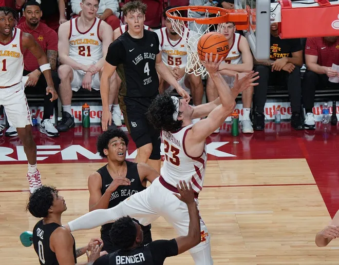 Iowa State Cyclones forward Blake Buchanan (23) shoots the ball over Long Beach State guard Shaquil Bender (2), guard BeachRob Diaz III (0), and guard Gavin Sykes (11) during the first half in the NCAA men’s basketball on Dec. 21, 2025, at Hilton Coliseum in Ames, Iowa.