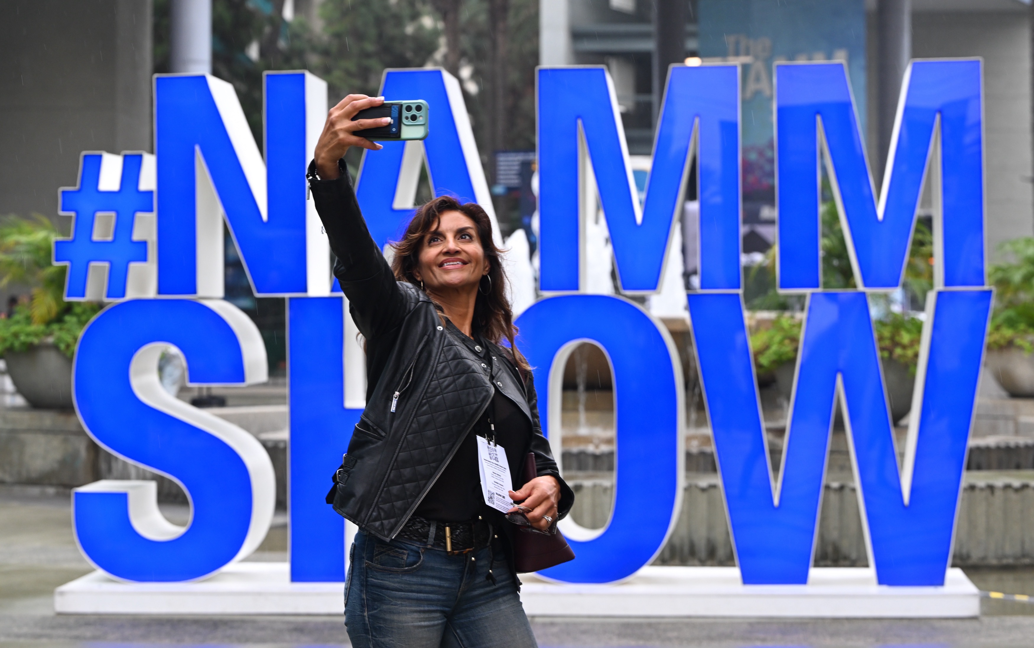 Marina Bello takes a selfie in front of giant letters...