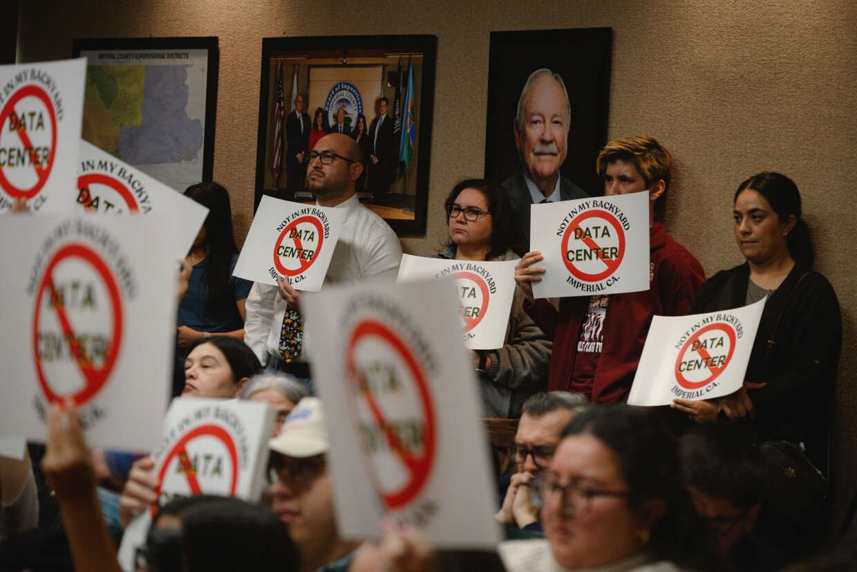 Opponents listen as the Imperial County Planning Commission holds a hearing on a lot merger for a massive planned data center near the city of Imperial on December 18, 2025 at the county administration building in El Centro, California.
