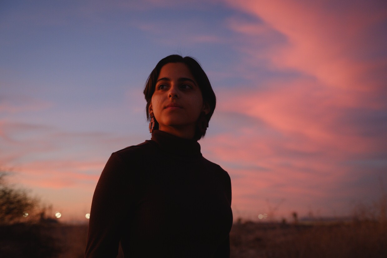 Imperial resident Kathia Olivas, a substitute teacher and community organizer, stands for a portrait at the planned site for a massive data center which would sit just blocks away from her parents' home in the small city of Imperial, California, on December 18, 2025. Olivas feels the developer and county officials haven't been transparent about their plans and fears the data center will place new stress on the land and local ecosystems. "This could have all been avoided if they had just been transparent with us," she said.