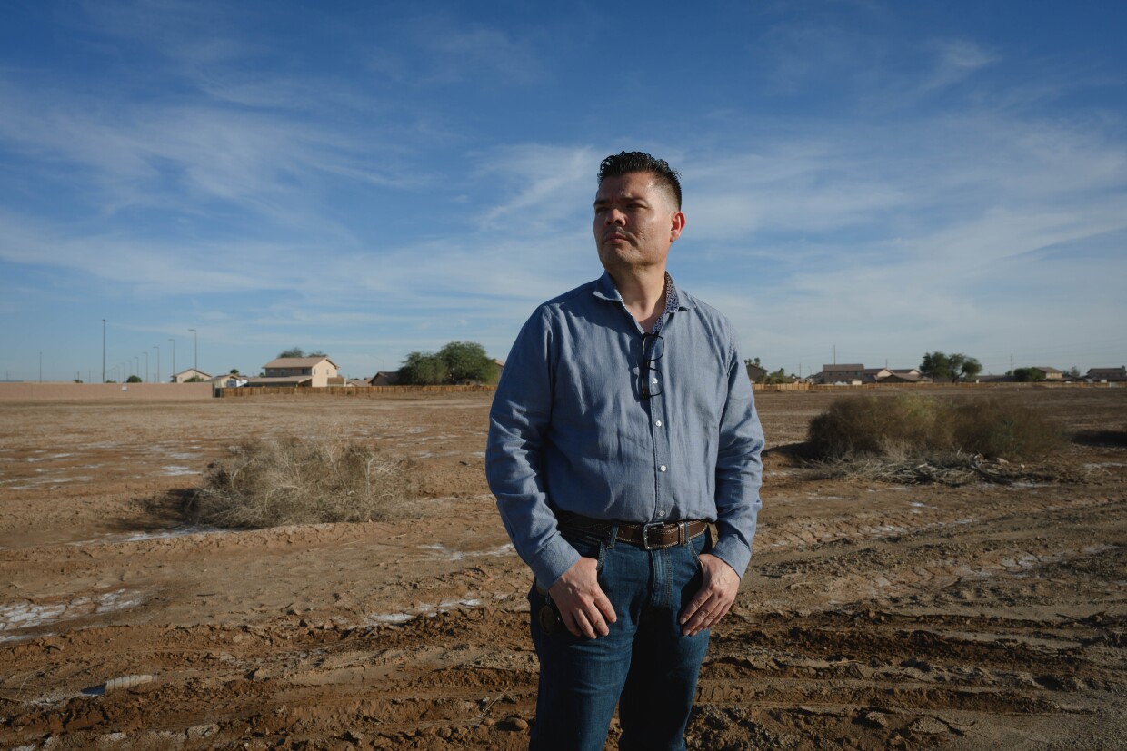 Imperial resident Francisco Leal stands for a portrait at the planned site for a massive data center, which would sit right next to his home in the small city of Imperial, California, on December 18, 2025. Leal fears the project will put new strain on the rural region's water and energy supply and could create other health risks like noise and air pollution. "At the end of the day, it's power and water," he said.
