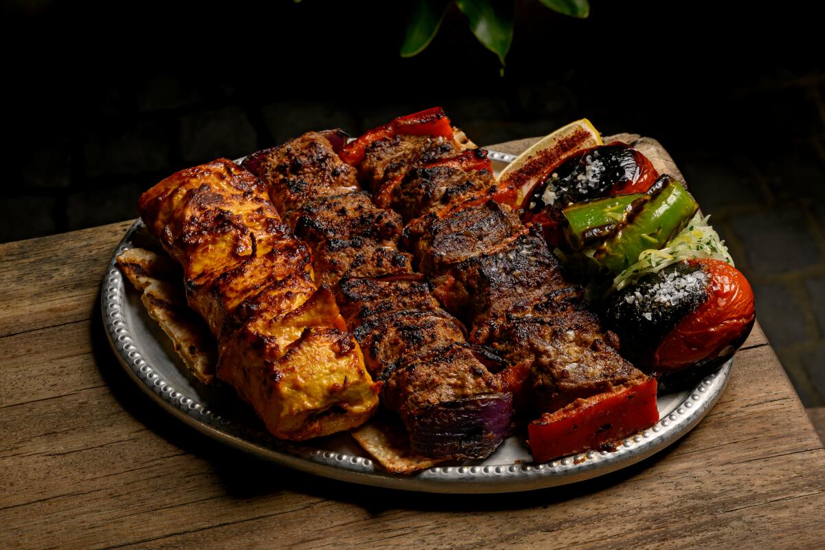 A plate of Kababs including Jujeh, Tikkeh Masti, and Chenjeh Kababs 