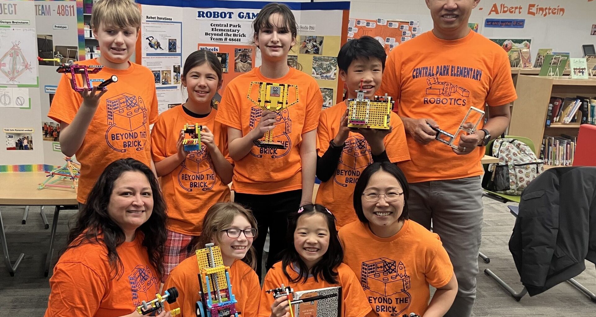 The "Beyond the Bricks" Central Park Elementary robotics team: (front row, from left) coach Lina Cano Ackerman, Camille Krause, Audrey Houser, coach SzeSze Ng; (back row, from left) Mason Curry, Evelyn Laitar, Cassey Ackerman, Bo Rui Koh, coach Shan Pin Koh. Not pictured is student Mark Xu.