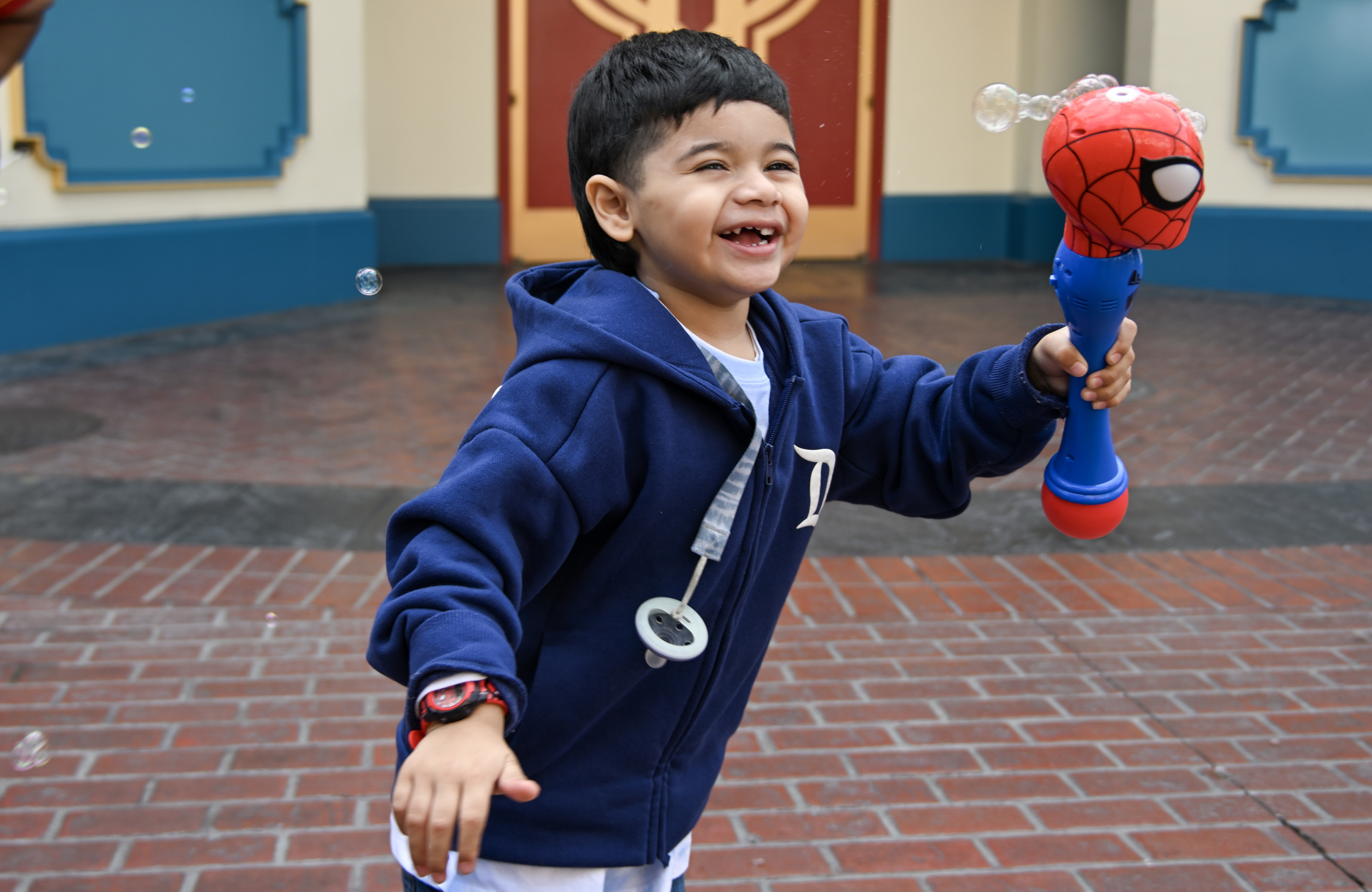 Edgar Flores, 4, plays with his Spider-Man bubble maker at...