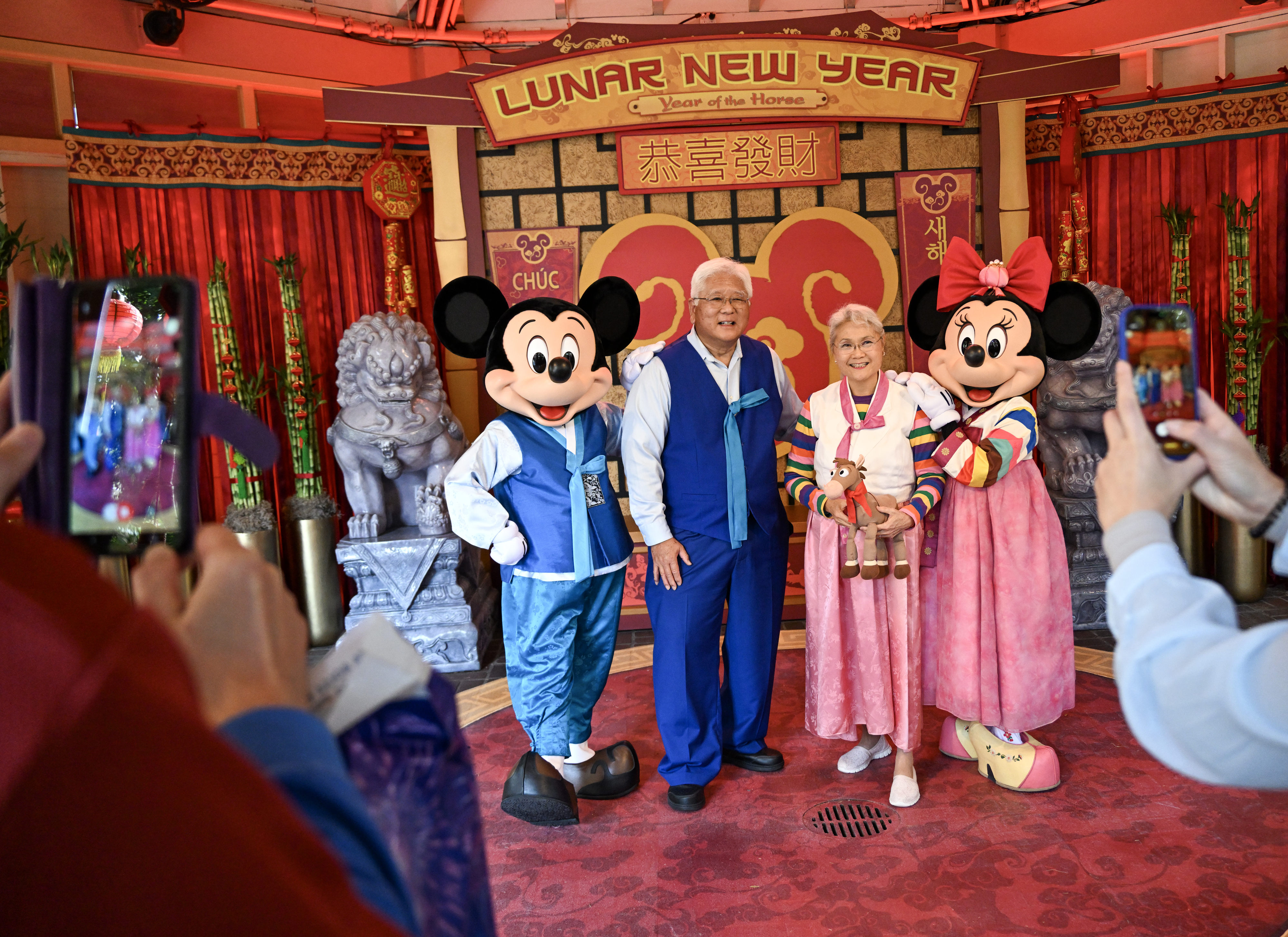 Steven Tani and his wife, Millie Tani, don outfits matching...