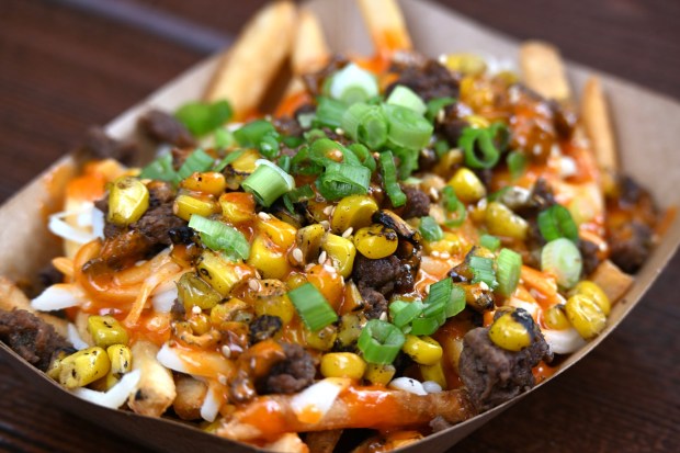 Bulgogi Fries with marinated beef, kimchi, cucumber, mozzarella cheese and gochujang aioli topped with sesame seeds and green onion available at Smokejumpers Grill in Grizzly Peak during Disney California Adventure's Lunar New Year celebration in Anaheim, CA, on Friday, January 23, 2026. They are celebrating The Year of the Horse January 23 through February 22, 2026. (Photo by Jeff Gritchen, Orange County Register/SCNG)