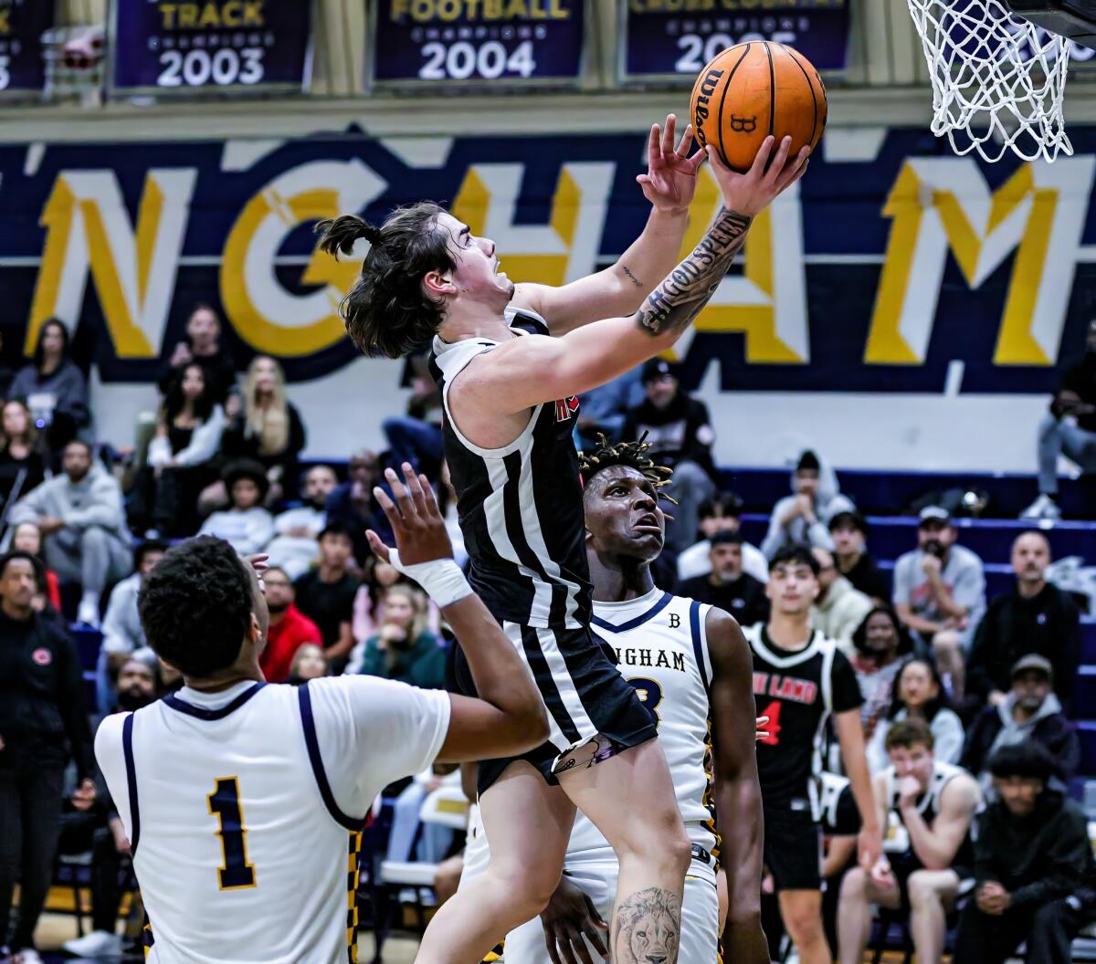 Charlie Adams drives for a layup.