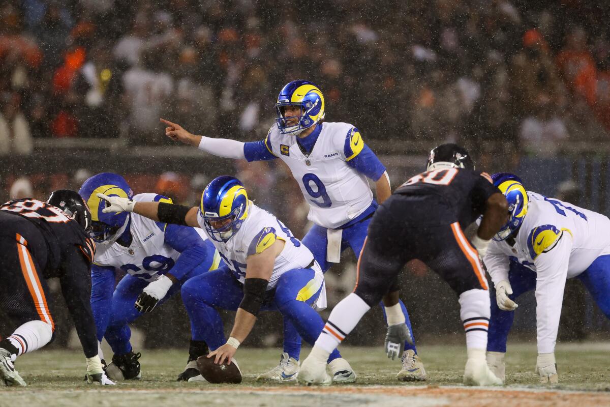 Rams quarterback Matthew Stafford signals before taking a snap.